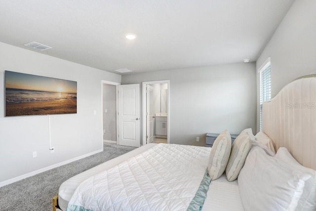 carpeted bedroom featuring connected bathroom