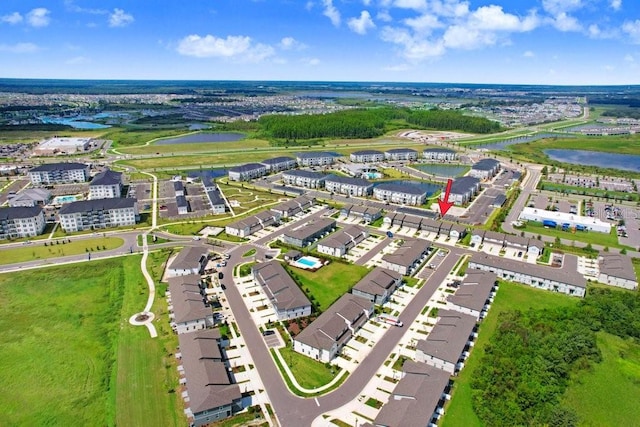 drone / aerial view with a water view