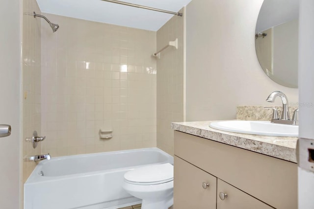 full bathroom featuring vanity, toilet, and tiled shower / bath