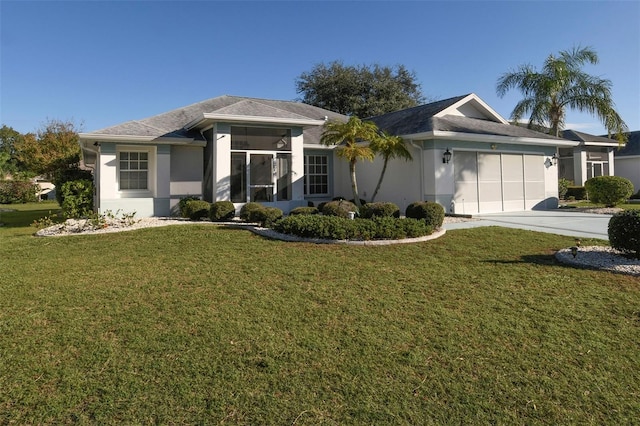 ranch-style home featuring a front yard, a garage, and a sunroom