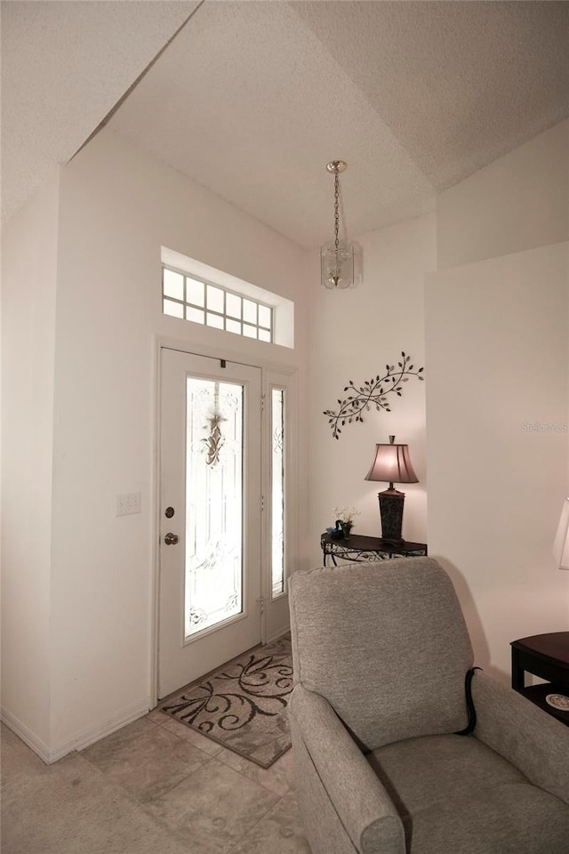 entrance foyer with a textured ceiling