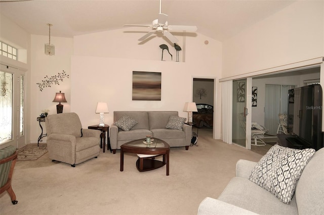 living room featuring ceiling fan, light colored carpet, and high vaulted ceiling