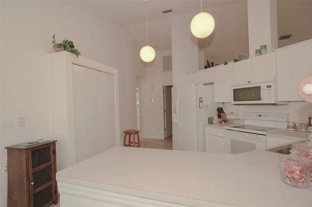 2451 E Del Webb Blvd, Sun City Center, FL 33573 - kitchen featuring white cabinets, visible vents, white appliances, pendant lighting, and light countertops