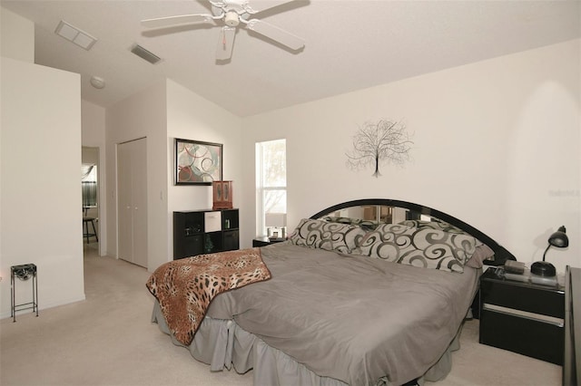 bedroom featuring vaulted ceiling, ceiling fan, and light colored carpet