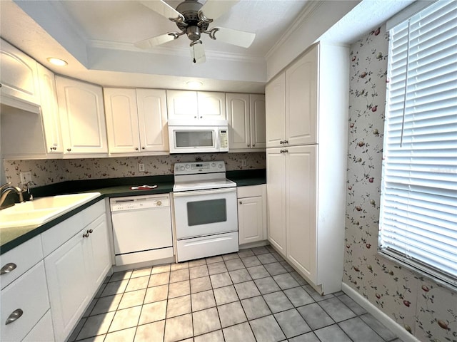 kitchen with white appliances, ceiling fan, white cabinetry, and light tile patterned floors