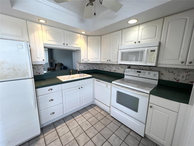 kitchen featuring ceiling fan, white cabinets, sink, and white appliances