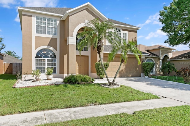 view of front of house featuring a front yard and a garage