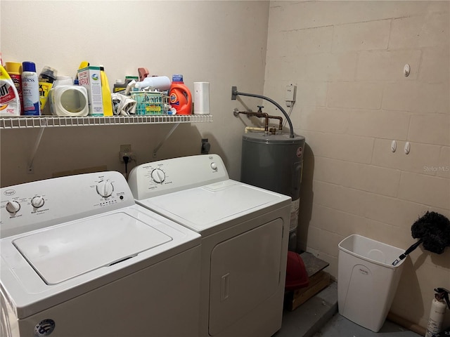 laundry area featuring electric water heater and washer and dryer