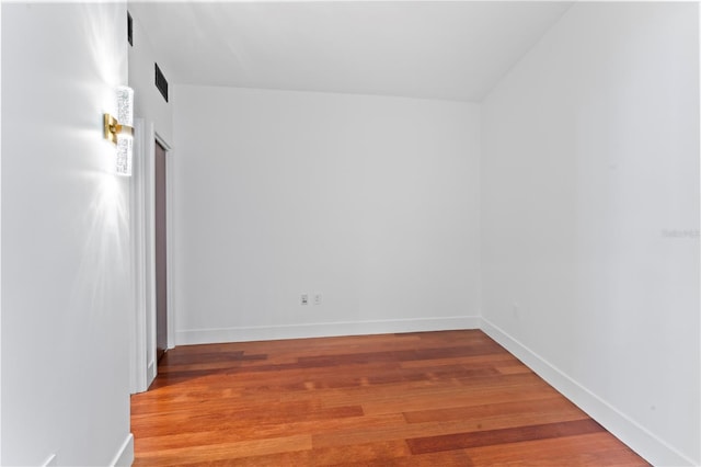 unfurnished room featuring wood-type flooring