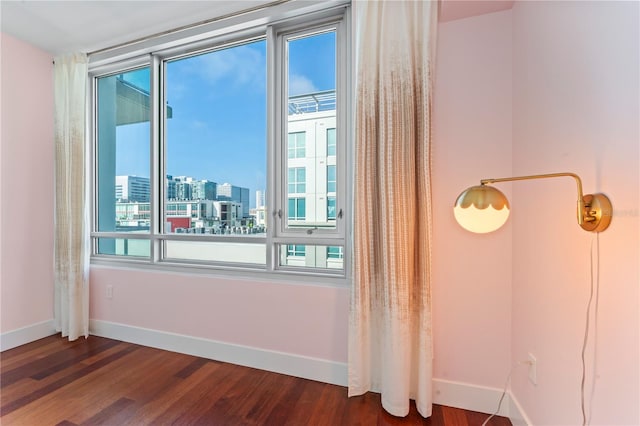 spare room featuring dark hardwood / wood-style floors