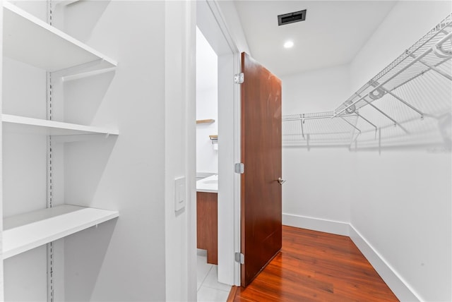 spacious closet with wood-type flooring