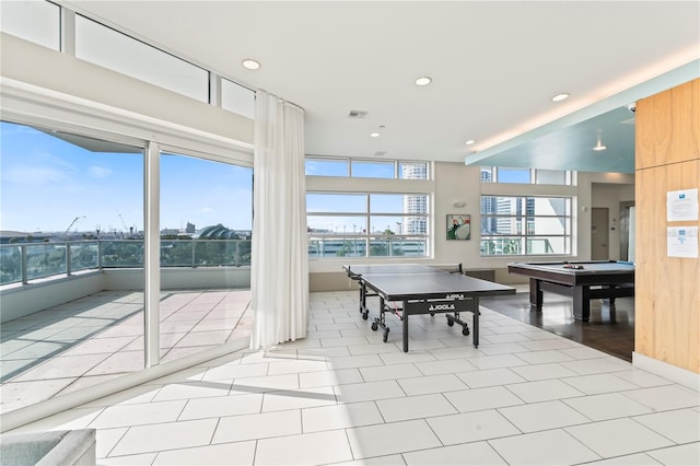 recreation room with light tile patterned flooring, pool table, and a wealth of natural light