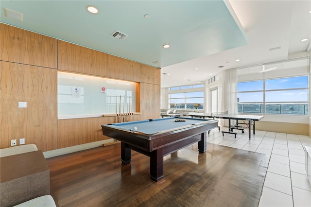 recreation room with wooden walls, light tile patterned flooring, and billiards