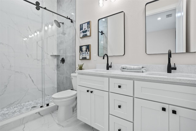 bathroom featuring toilet, vanity, and walk in shower