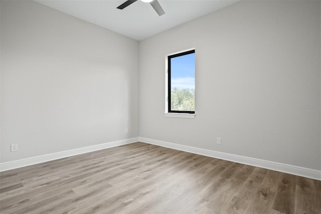 spare room with light hardwood / wood-style flooring and ceiling fan