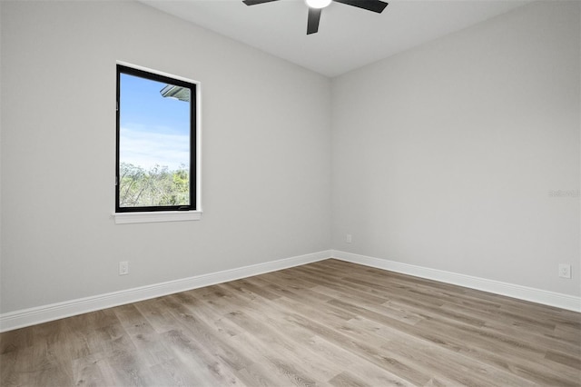 empty room featuring light hardwood / wood-style flooring and ceiling fan