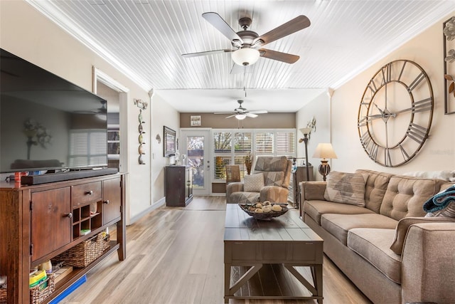 living room with ornamental molding, wooden ceiling, light wood-type flooring, and ceiling fan