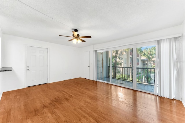 spare room featuring hardwood / wood-style floors, a textured ceiling, and ceiling fan