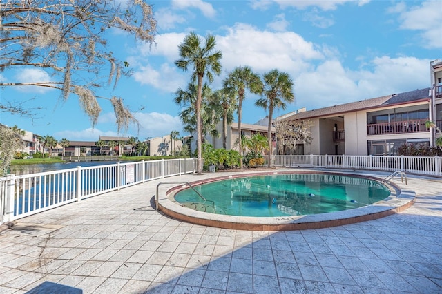 view of swimming pool with a patio area