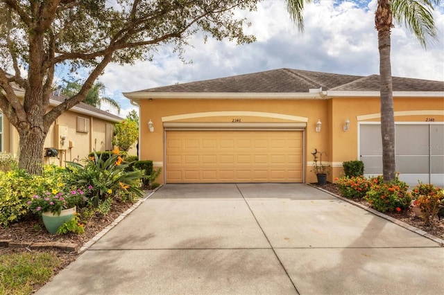 ranch-style home featuring a garage