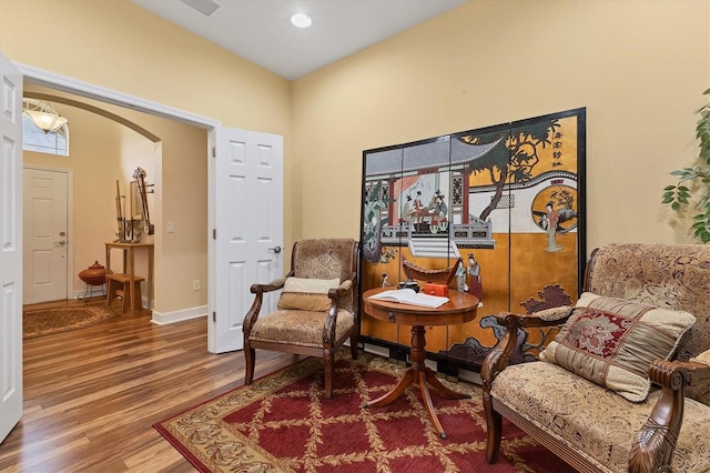 living area with hardwood / wood-style floors