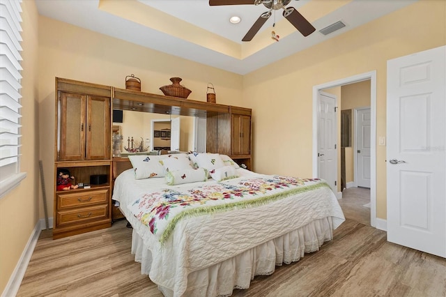 bedroom with light wood-type flooring and ceiling fan