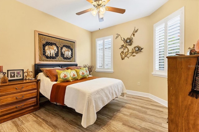 bedroom featuring ceiling fan and light hardwood / wood-style floors