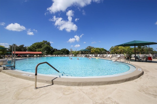 view of swimming pool with a patio area