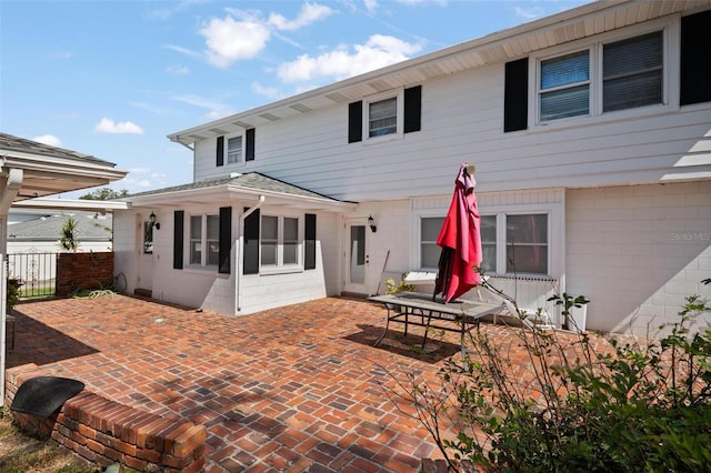 back of house with a patio area