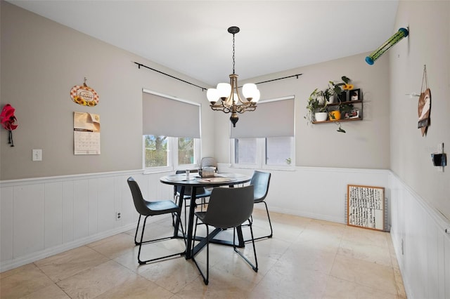 dining area with an inviting chandelier