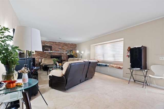 living room featuring ornamental molding and a brick fireplace