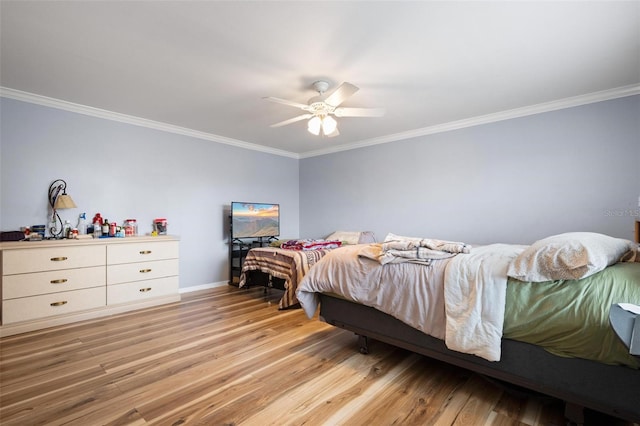 bedroom with ceiling fan, crown molding, and light wood-type flooring