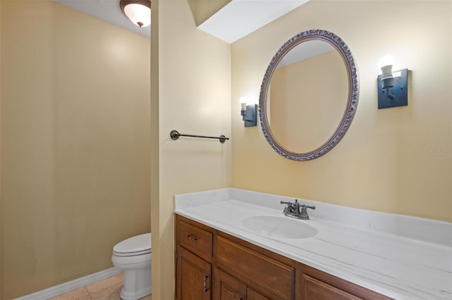 bathroom featuring vanity, toilet, and tile patterned flooring