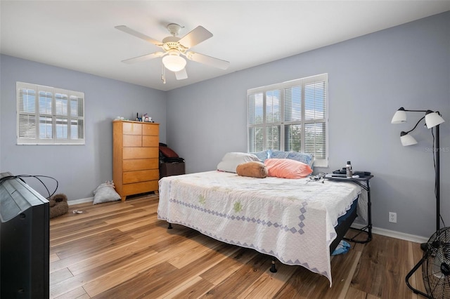 bedroom featuring ceiling fan and hardwood / wood-style floors