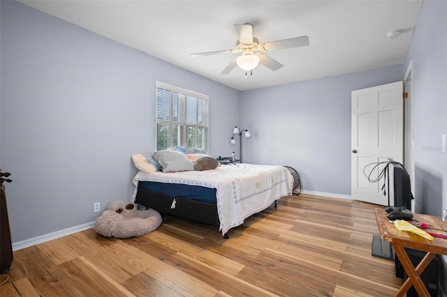 bedroom featuring light wood-type flooring and ceiling fan