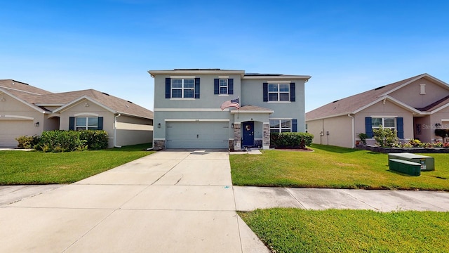 view of front property featuring a garage and a front lawn