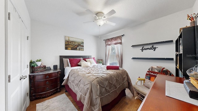 bedroom with ceiling fan and hardwood / wood-style flooring