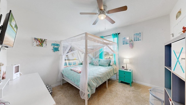 bedroom with ceiling fan and light colored carpet