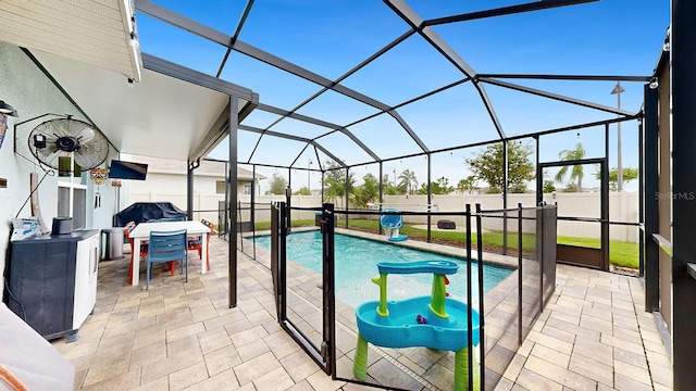 view of swimming pool featuring glass enclosure, a patio, and a grill