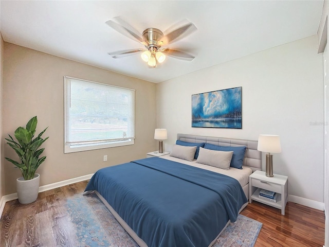 bedroom featuring dark hardwood / wood-style flooring and ceiling fan