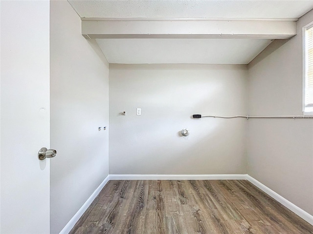 clothes washing area with wood-type flooring