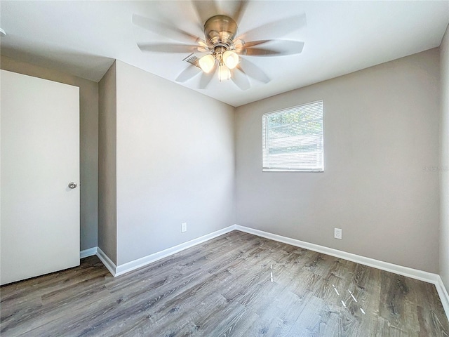 unfurnished room featuring light hardwood / wood-style flooring and ceiling fan