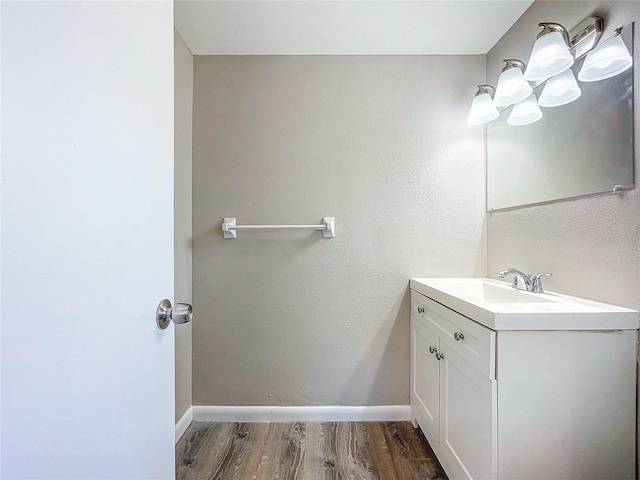 bathroom with wood-type flooring and vanity