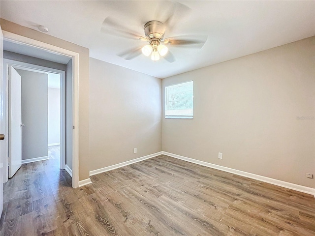 unfurnished room with wood-type flooring and ceiling fan