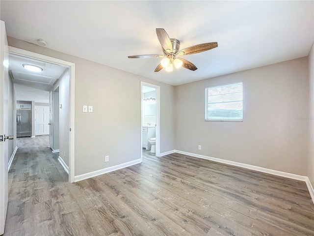 empty room featuring wood-type flooring and ceiling fan