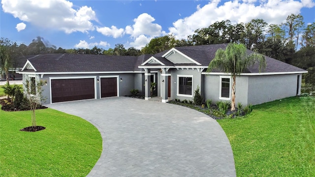 view of front facade with a front lawn and a garage