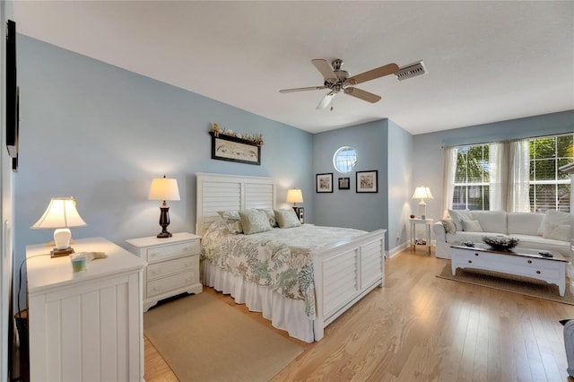 bedroom with ceiling fan and light wood-type flooring