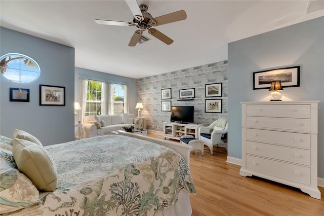 bedroom with ceiling fan and light hardwood / wood-style flooring