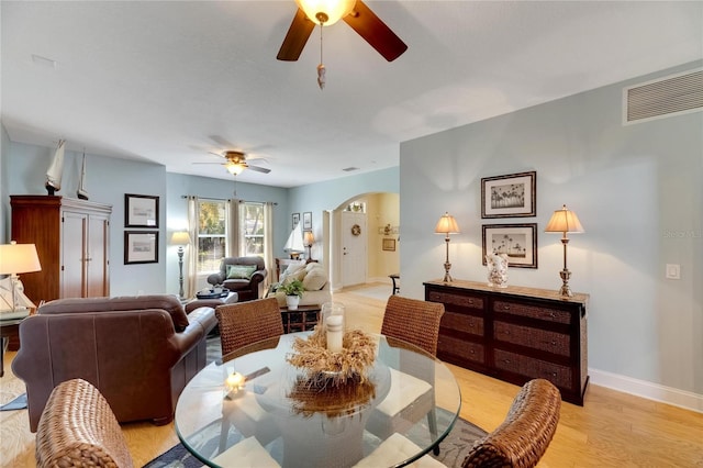 dining area featuring light hardwood / wood-style floors and ceiling fan