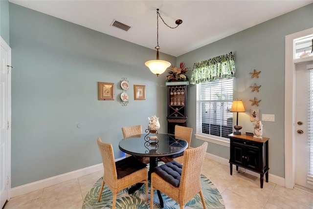 dining area featuring light tile patterned floors